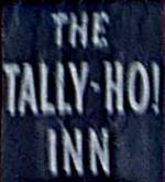 The pub sign. The Tally-Ho! Inn, Broughton, Hampshire
