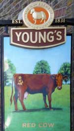 The pub sign. The Red Cow, Richmond, Greater London