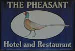 The pub sign. The Pheasant Hotel, Weybourne, Norfolk