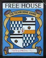 The pub sign. The Tichborne Arms, Tichborne, Hampshire