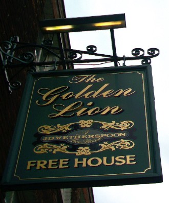 The pub sign. The Golden Lion Hotel, Rochester, Kent