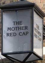 The pub sign. Mother Red Cap, Upper Holloway, Greater London