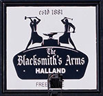 The pub sign. The Blacksmith's Arms (formerly Black Lion Inn), Halland, East Sussex
