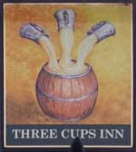 The pub sign. Three Cups Inn, Three Cups Corner, East Sussex