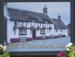 The pub sign. The Wheatsheaf Inn, Raby, Merseyside