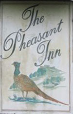 The pub sign. The Pheasant Inn, Higher Buwardsley, Cheshire