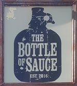 The pub sign. The Bottle of Sauce, Cheltenham, Gloucestershire