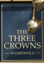 The pub sign. The Three Crowns, Wymeswold, Leicestershire