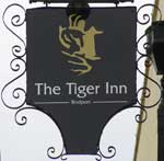 The pub sign. The Tiger Inn, Bridport, Dorset