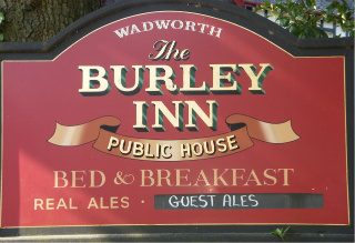 The pub sign. The Burley Inn, Burley, Hampshire