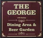 The pub sign. The George, Charmouth, Dorset