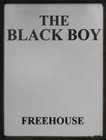 The pub sign. Black Boy, Winchester, Hampshire