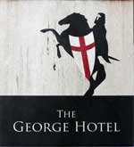 The pub sign. The George Hotel, Cranbrook, Kent