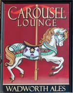 The pub sign. Carousel Lounge, Hythe, Kent