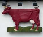 The pub sign. The Red Cow, Sandwich, Kent