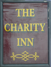 The pub sign. The Charity Inn, Woodnesborough, Kent