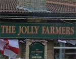 The pub sign. The Jolly Farmers, Southery, Norfolk