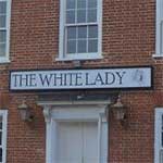The pub sign. The White Lady, Worstead, Norfolk