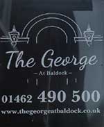 The pub sign. The George, Baldock, Hertfordshire