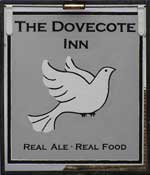 The pub sign. The Dovecote Inn, Capel-le-Ferne, Kent