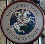 The pub sign. The George Hotel, Whittlesey, Cambridgeshire
