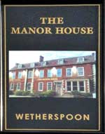 The pub sign. The Manor House, Royston, Hertfordshire