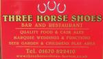 The pub sign. Three Horseshoes, Horton, Northumberland