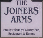 The pub sign. The Joiners Arms, High Newton-by-the-Sea, Northumberland