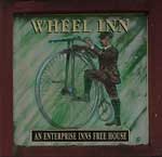 The pub sign. Wheel Inn, Ashbourne, Derbyshire