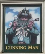 The pub sign. Cunning Man, Burghfield, Berkshire