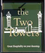 The pub sign. Two Towers, West Norwood, Greater London