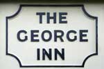 The pub sign. The George Inn, Broadstairs, Kent