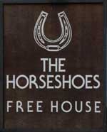 The pub sign. Horsehoes, Ringsfield, Suffolk