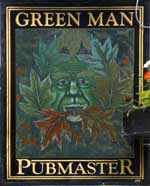 The pub sign. Green Man, Colne, Cambridgeshire