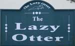 The pub sign. The Lazy Otter, Stretham, Cambridgeshire