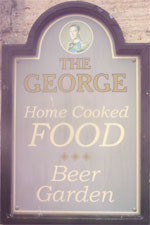 The pub sign. The George, Weldon, Northamptonshire