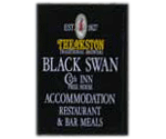 The pub sign. The Black Swan, Middleham, North Yorkshire