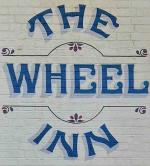 The pub sign. Wheel Inn, Westwell, Kent