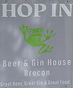 The pub sign. Hop In Beer & Gin House, Brecon, Powys