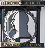 The pub sign. The George Hotel, Brecon, Powys