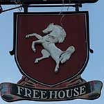 The pub sign. The White Horse, Bilsington, Kent