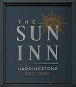 The pub sign. The Sun Inn, Hardingstone, Northamptonshire