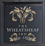 The pub sign. The Wheatsheaf Inn, Ludlow, Shropshire