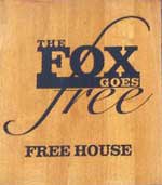 The pub sign. The Fox Goes Free, Charlton, West Sussex