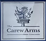 The pub sign. Carew Arms, Crowcombe, Somerset