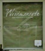 The pub sign. The Woodmancote, Woodmancote, West Sussex