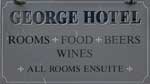 The pub sign. George Hotel, Axminster, Devon
