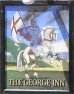 The pub sign. The George Inn, Chardstock, Devon